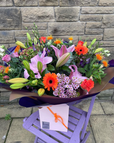 Bold and Beautiful - This hand tied bouquet in stunning bright colours is sure to wow all your nearest anddearest