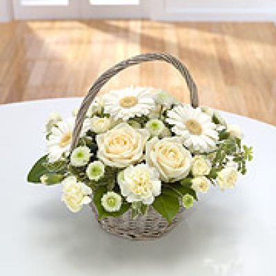Memories - A beautiful White basket with a gorgeous selection of seasonal blooms